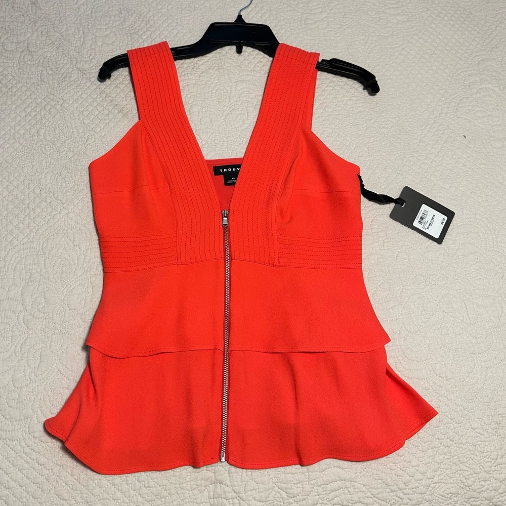 Trouve. The blouse is orange, red exact color.